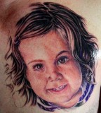 Cute Baby Face Chest Tattoo Designs