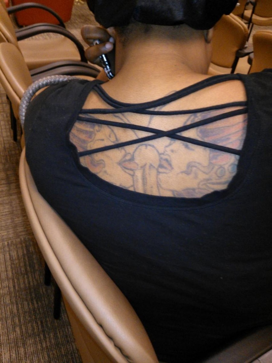 Bold yet Funny Adult Stuff Tattoo on Women Back (NSFW)