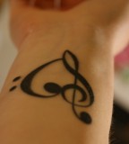 Treble and Bass Clef Heart Tattoo - Wrist Tattoo