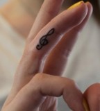 Treble Clef Tattoo on Hand for Women