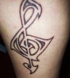 Wonderful Tribal Treble Clef Tattoo Design for Men