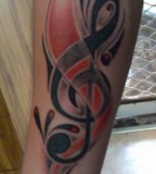 Awesome Treble Clef Music Tattoo Design