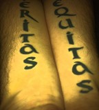 Long Lettering of Veritas Aequitas Tattoo on Leg