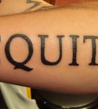 Aequitas Part of Veritas Aequitas Lettering Tattoo on Outer Lower Arm