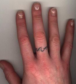 Unique Scripture Wedding Ring Themed Tattoo on Finger