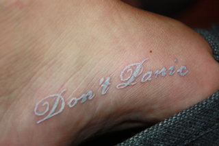 White Ink Tattoo On Girl Foot