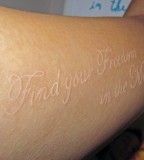 White Tattoos Lettering On Forearm