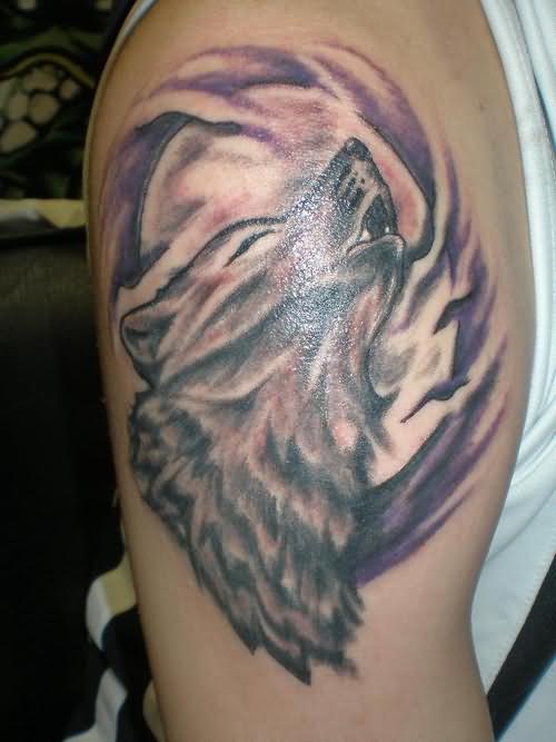 Wolf Haunting Tattoo On Bicep